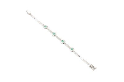 Lot 231 - AN EMERALD AND DIAMOND BRACELET, each...