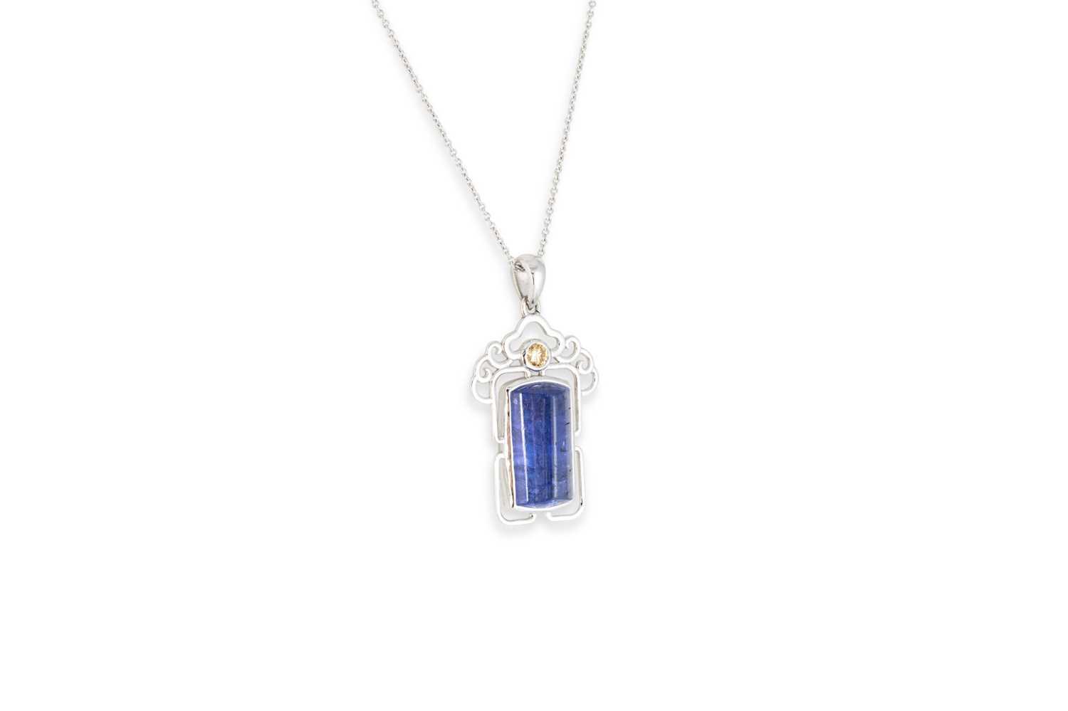 Lot 68 - A TANZANITE AND DIAMOND PENDANT, the cabochon...