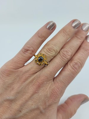 Lot 131 - A DIAMOND CLUSTER RING, the opaque rose cut...