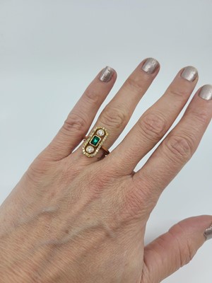 Lot 133 - AN EMERALD AND DIAMOND CLUSTER RING, of plaque...