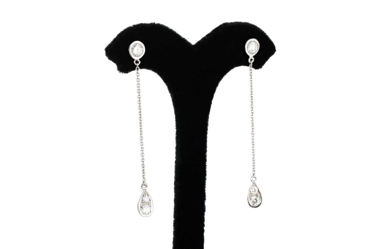 Lot 253 - A PAIR OF DIAMOND DROP EARRINGS, the round...