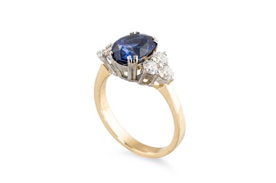 Lot 265 - A SAPPHIRE AND DIAMOND RING, the oval sapphire...