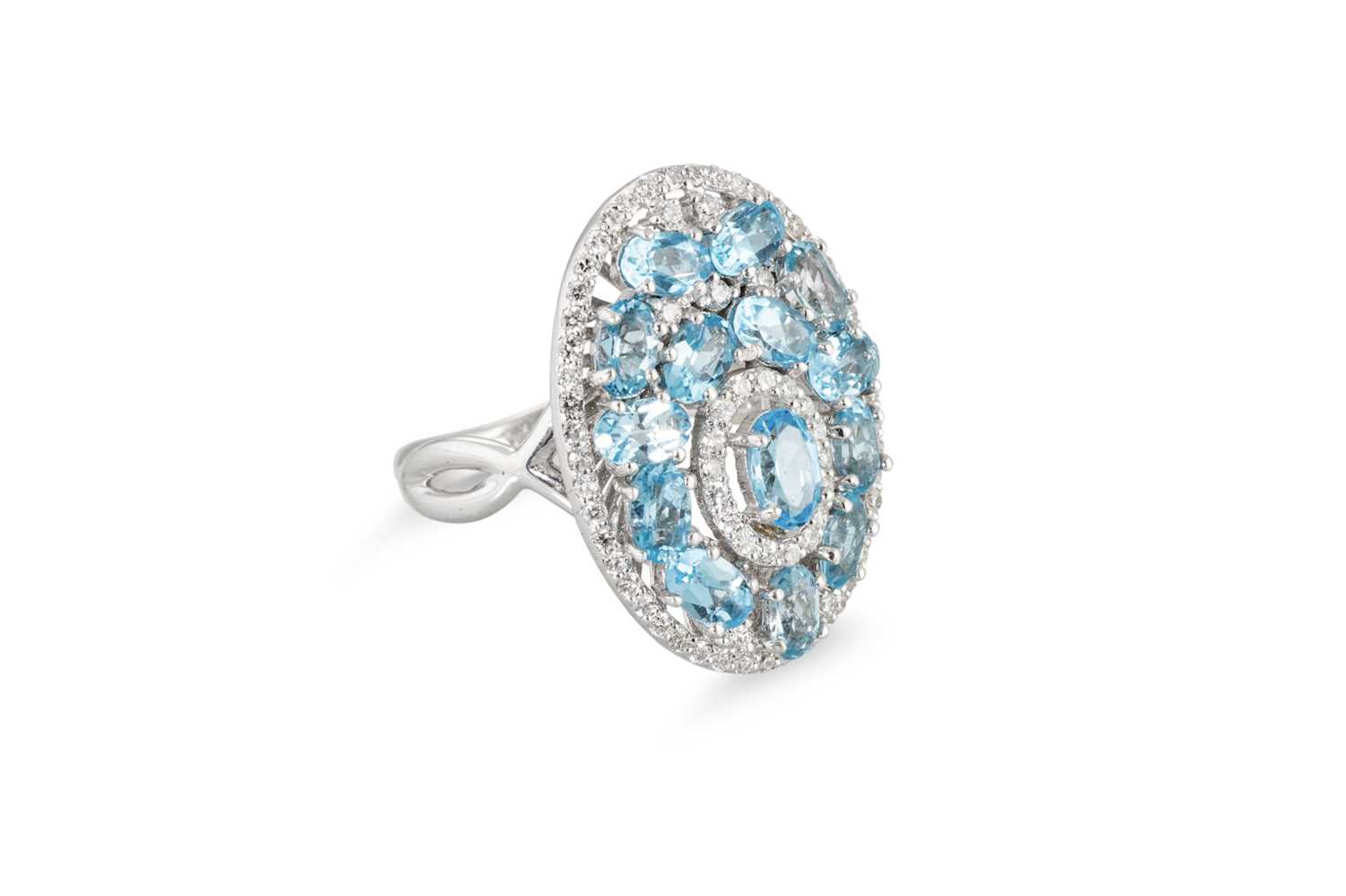 Lot 266 - A TOPAZ AND DIAMOND CLUSTER RING, set in 18ct...
