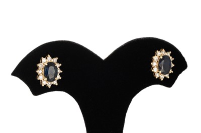 Lot 85 - A PAIR OF DIAMOND AND SAPPHIRE CLUSTER...