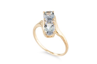 Lot 106 - A TOPAZ CLUSTER RING, of cross over style, the...
