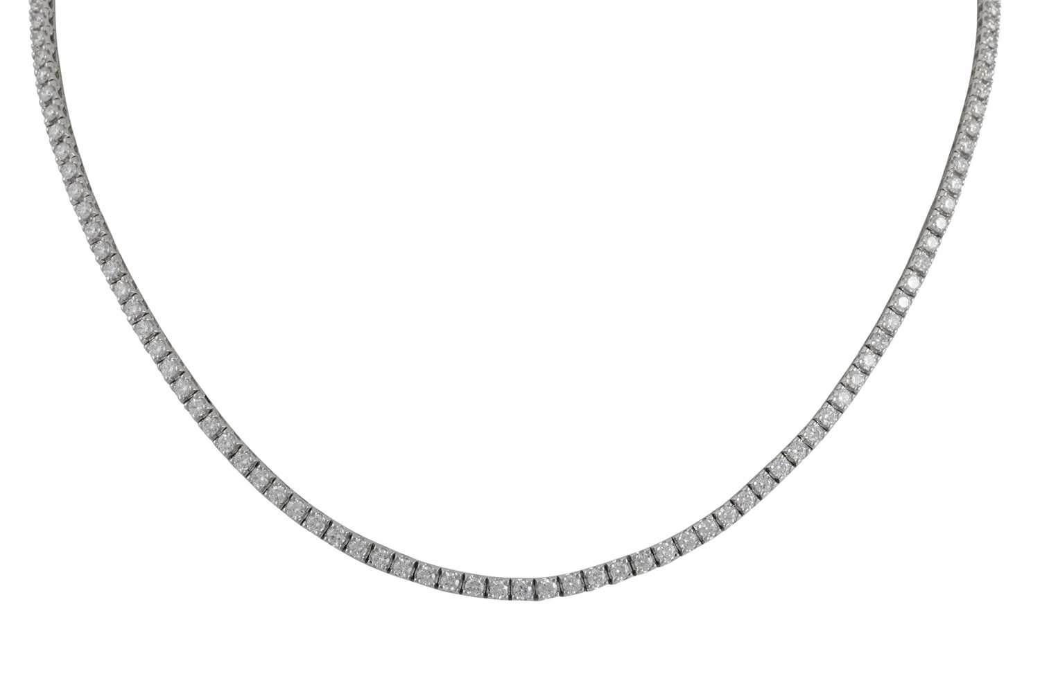 Lot 218 - A DIAMOND LINE NECKLACE, the brilliant cut...