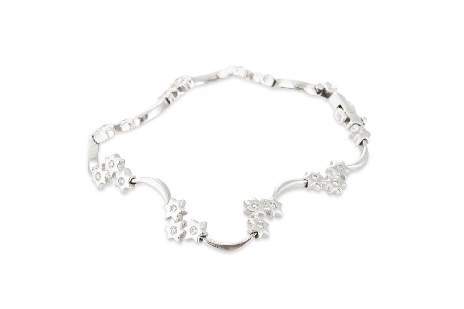 Lot 138 - A DIAMOND SET BRACELET, the brilliant cut...