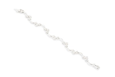 Lot 138 - A DIAMOND SET BRACELET, the brilliant cut...