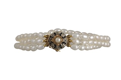 Lot 222 - A PEARL AND DIAMOND BRACELET, the three strand...