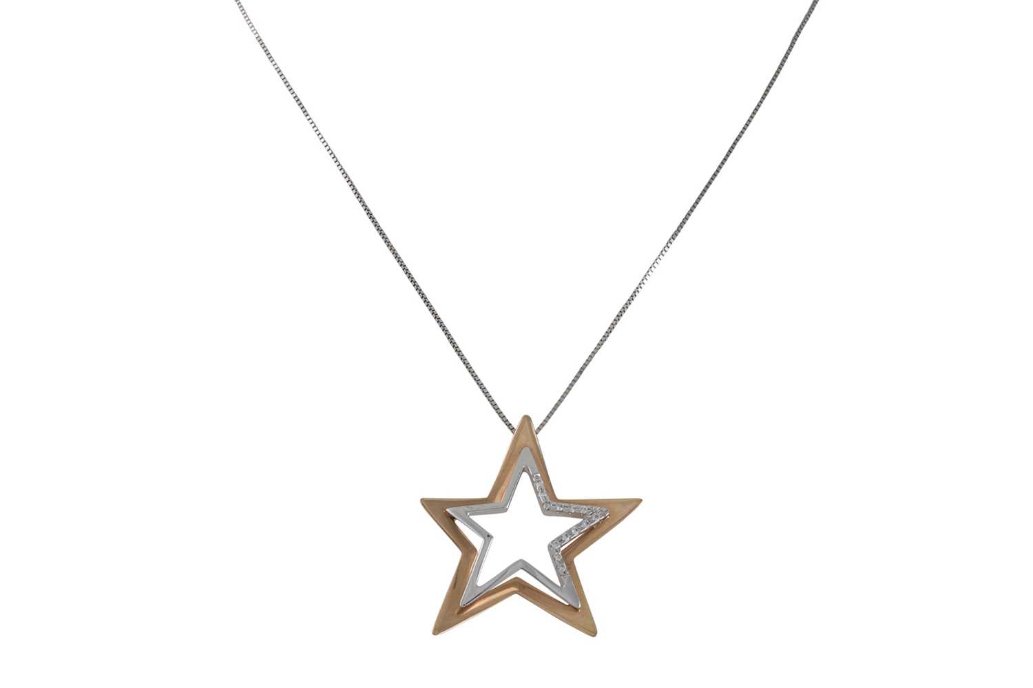 Lot 234 - A DIAMOND SET PENDANT, modelled as a star set...