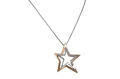 Lot 234 - A DIAMOND SET PENDANT, modelled as a star set...