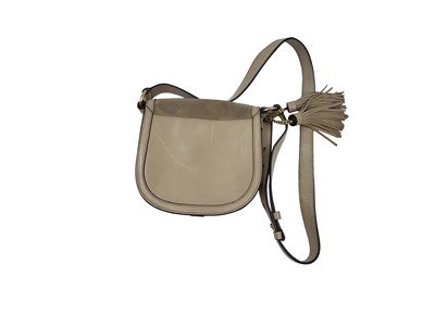 Lot 245 - A MICHAEL KORS CROSSOVER HAND BAG, cream...