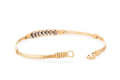Lot 37 - A YELLOW GOLD BANGLE, 3 g., unmarked XRF...