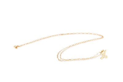 Lot 39 - A GOLD NECKLACE, with the letter 'M' attached,...
