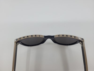 Lot 239 - A PAIR OF LADY'S CHANEL SUNGLASSES, leather...