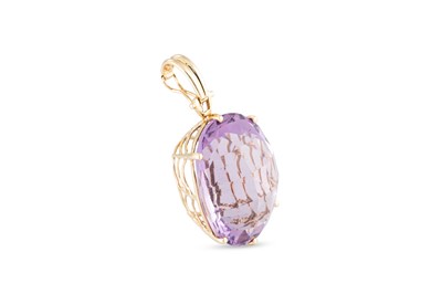 Lot 10 - AN AMETHYST SET PENDANT, the oval mixed cut...