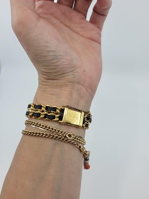 Lot 233 - A LADY'S CHANEL GOLD PLATED QUARTZ WRISTWATCH,...