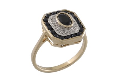 Lot 20 - A DIAMOND AND SAPPHIRE CLUSTER RING, of square...