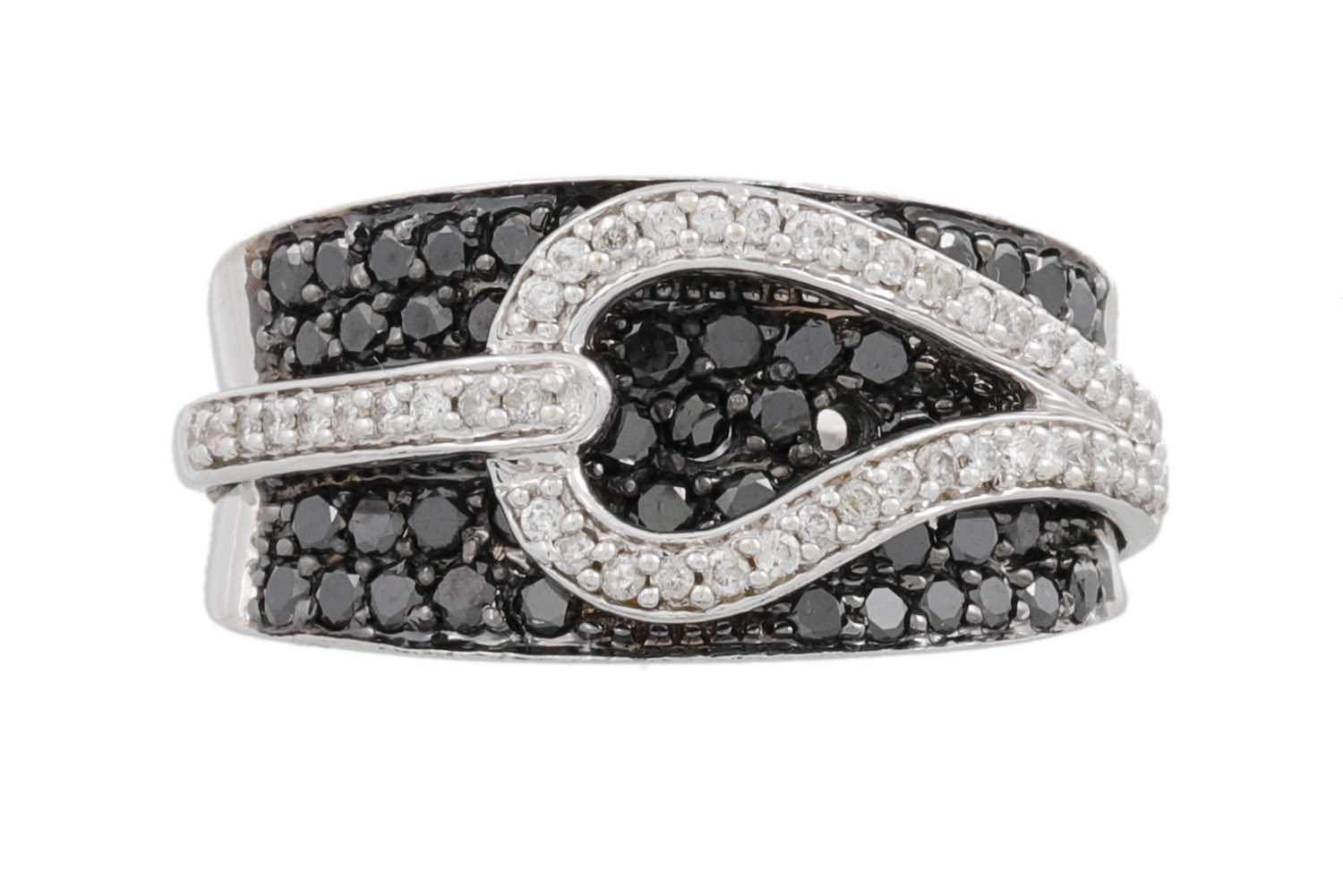 Lot 26 - A BLACK AND WHITE DIAMOND DRESS RING, pavé set...