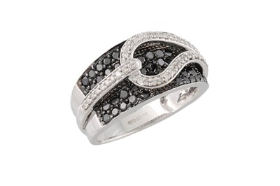 Lot 26 - A BLACK AND WHITE DIAMOND DRESS RING, pavé set...