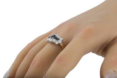 Lot 26 - A BLACK AND WHITE DIAMOND DRESS RING, pavé set...