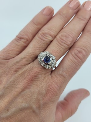 Lot 63 - AN ART DECO SAPPHIRE AND DIAMOND RING, the...