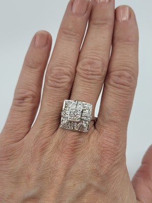 Lot 64 - AN ART DECO DIAMOND CLUSTER RING, of square...