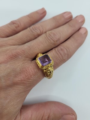 Lot 75 - AN ANTIQUE AMETHYST RING, with a table cut...