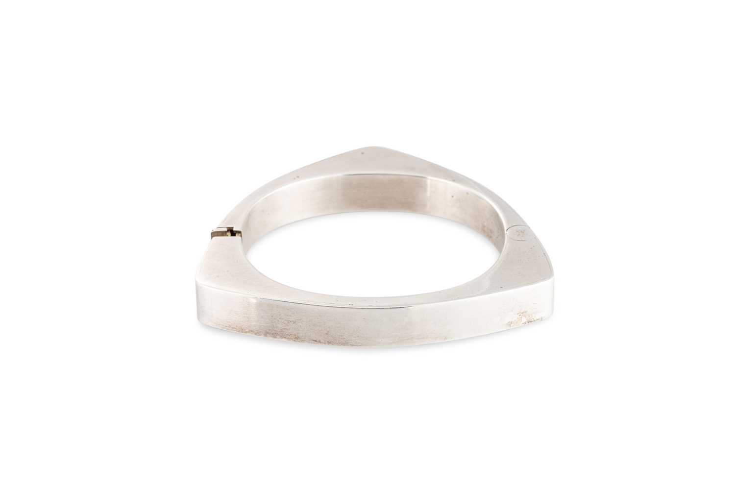 Lot 68 - A 1970S STERLING SILVER BANGLE, rounded...