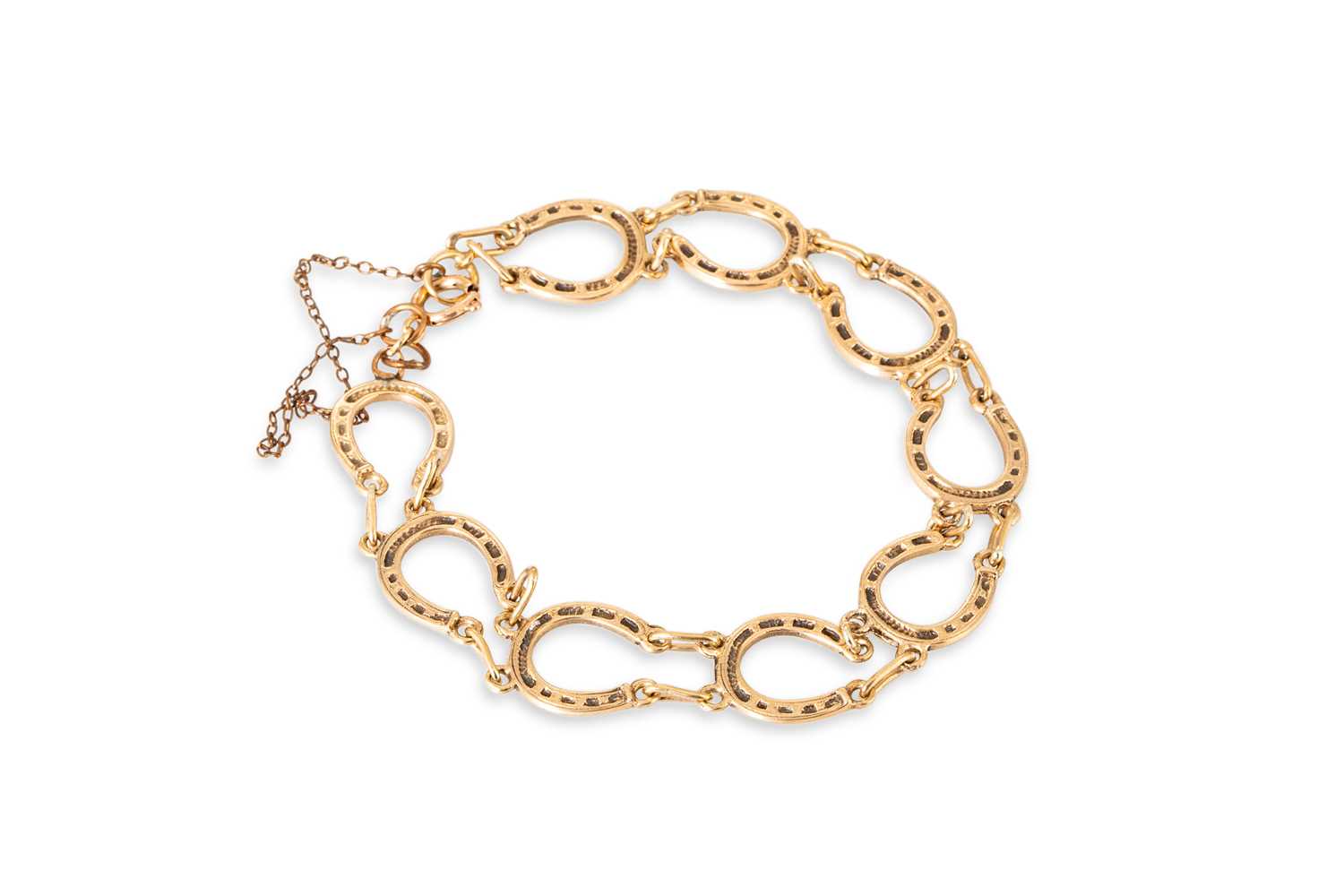 Lot 9 - A 9CT GOLD BRACELET OF HORSESHOE MOTIF LINKS,...