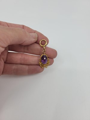 Lot 285 - AN AMETHYST SET DROP PENDANT, modern...