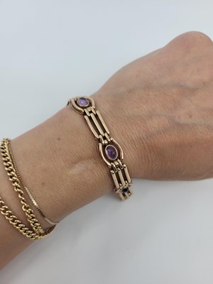 Lot 385 - A 9CT GOLD GATE BRACELET, set with padlock...