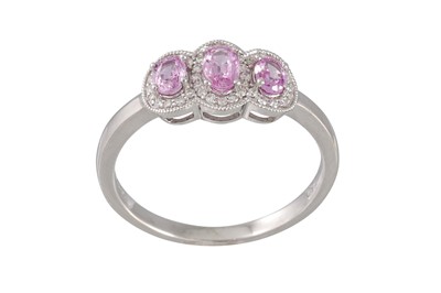 Lot 47 - A DIAMOND AND PINK SAPPHIRE DRESS RING,...
