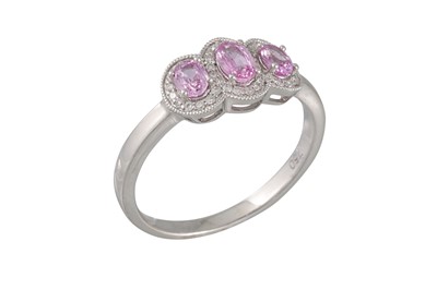 Lot 47 - A DIAMOND AND PINK SAPPHIRE DRESS RING,...
