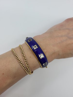 Lot 25 - A VICTORIAN ENAMEL AND PASTE BANGLE, the royal...