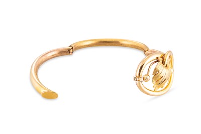 Lot 41 - A VICTORIAN GOLD PLATED SHAPED BANGLE, of...
