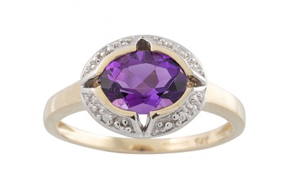 Lot 49 - A DIAMOND AND AMETHYST CLUSTER RING, mounted...