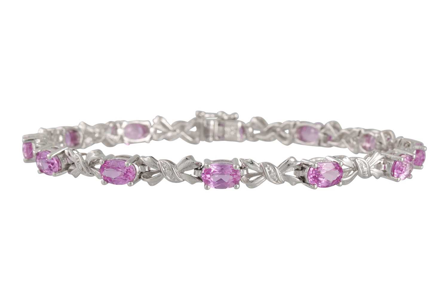 Lot 50 - A DIAMOND AND PINK GEM SET BRACELET, the...