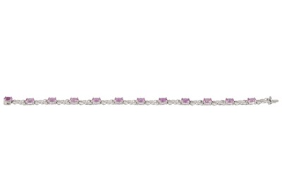 Lot 50 - A DIAMOND AND PINK GEM SET BRACELET, the...