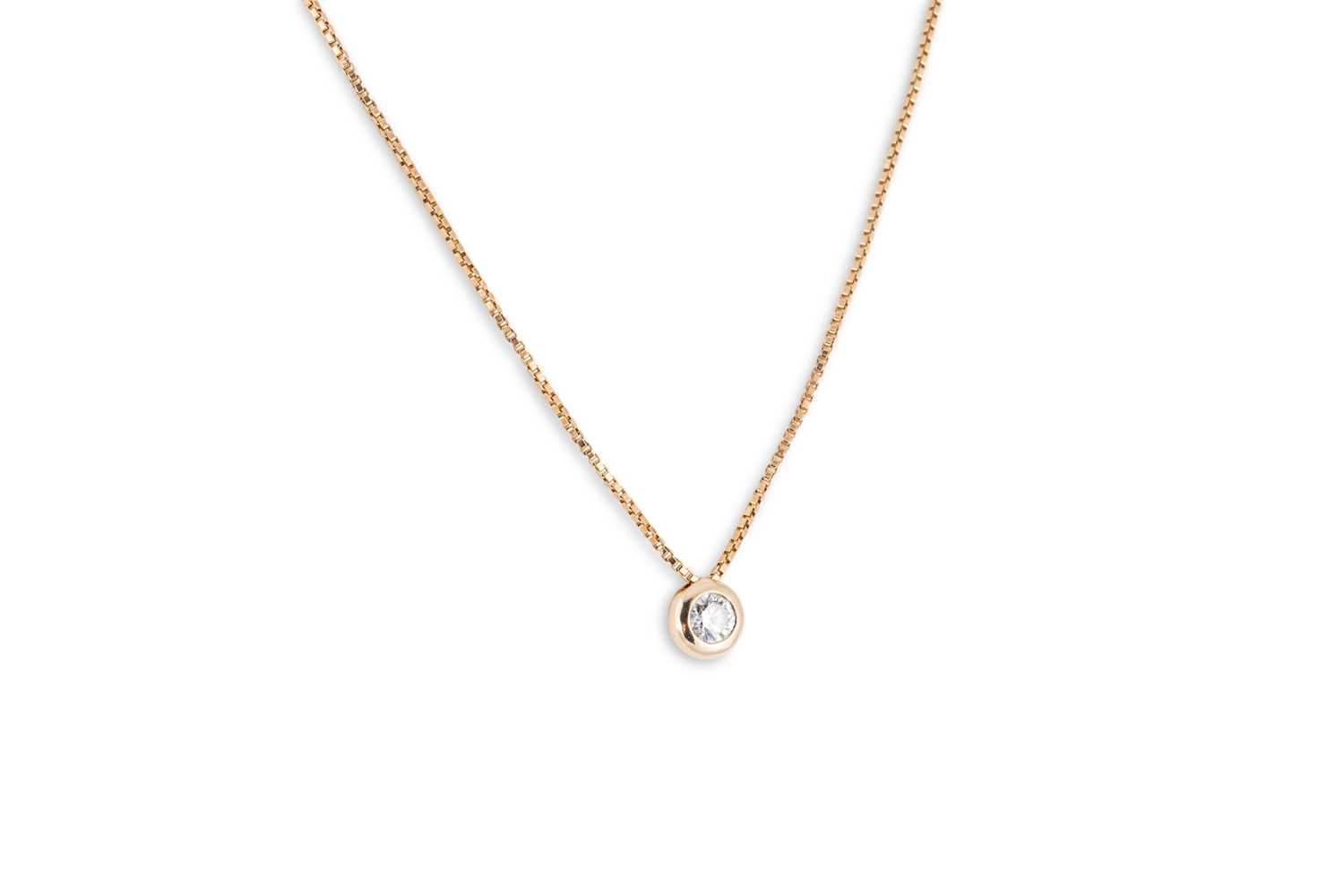 Lot 68 - A DIAMOND PENDANT, the round brilliant cut...