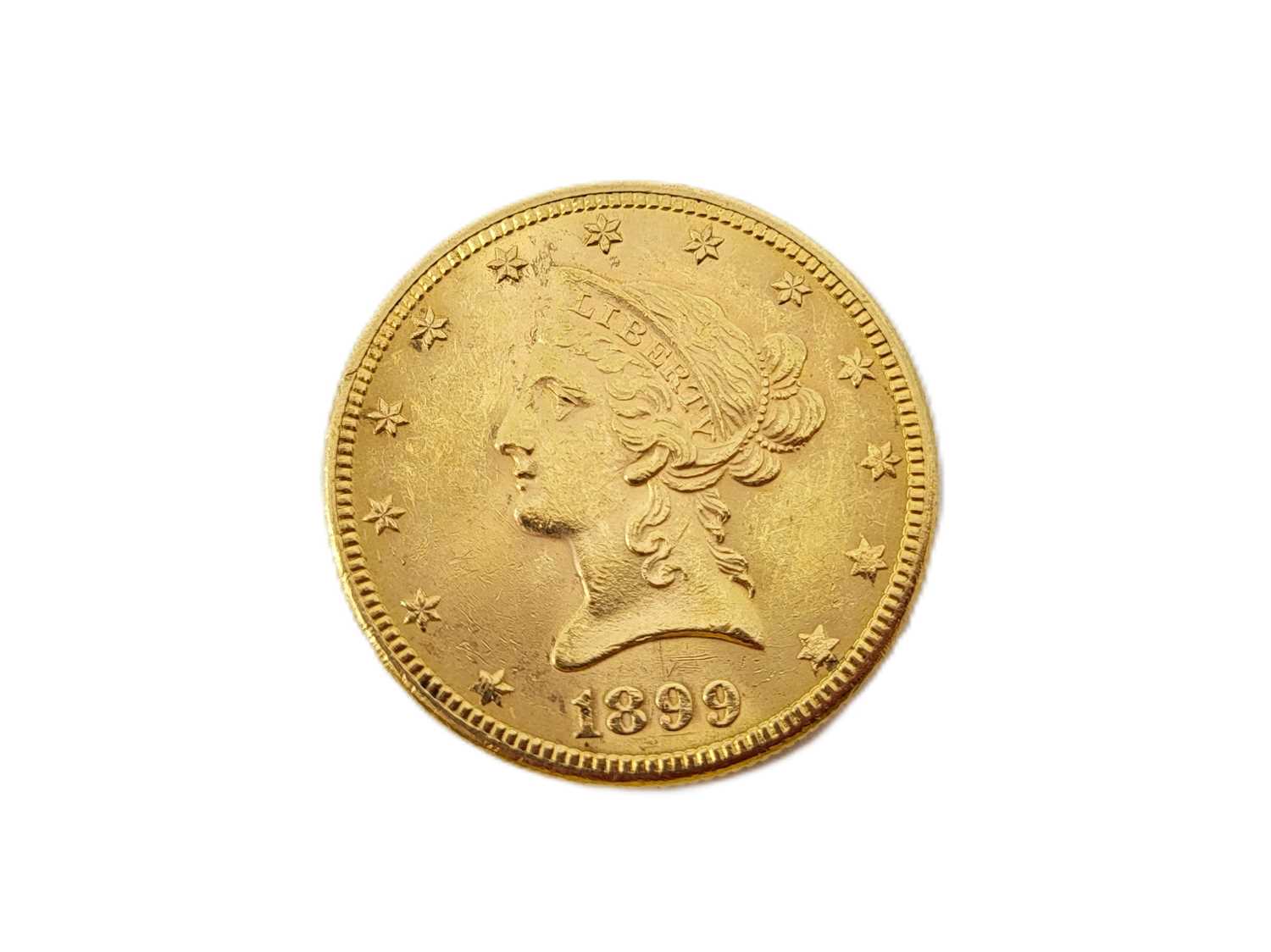 Lot 469 - A 1899 USA $10 GOLD EAGLE COIN, 0.90, 16 g., EF