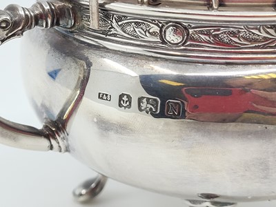 Lot 541 - A SMALL TWIN-HANDLED SILVER BOWL, with flower...