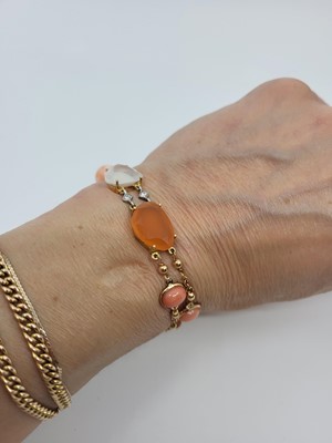 Lot 92 - AN ITALIAN DESIGN CHALCEDONY, CORAL, AND...