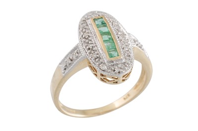 Lot 63 - A DIAMOND AND EMERALD OVAL SHAPED RING, the...