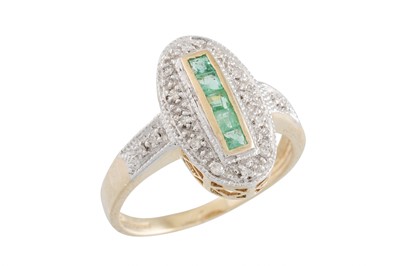 Lot 63 - A DIAMOND AND EMERALD OVAL SHAPED RING, the...
