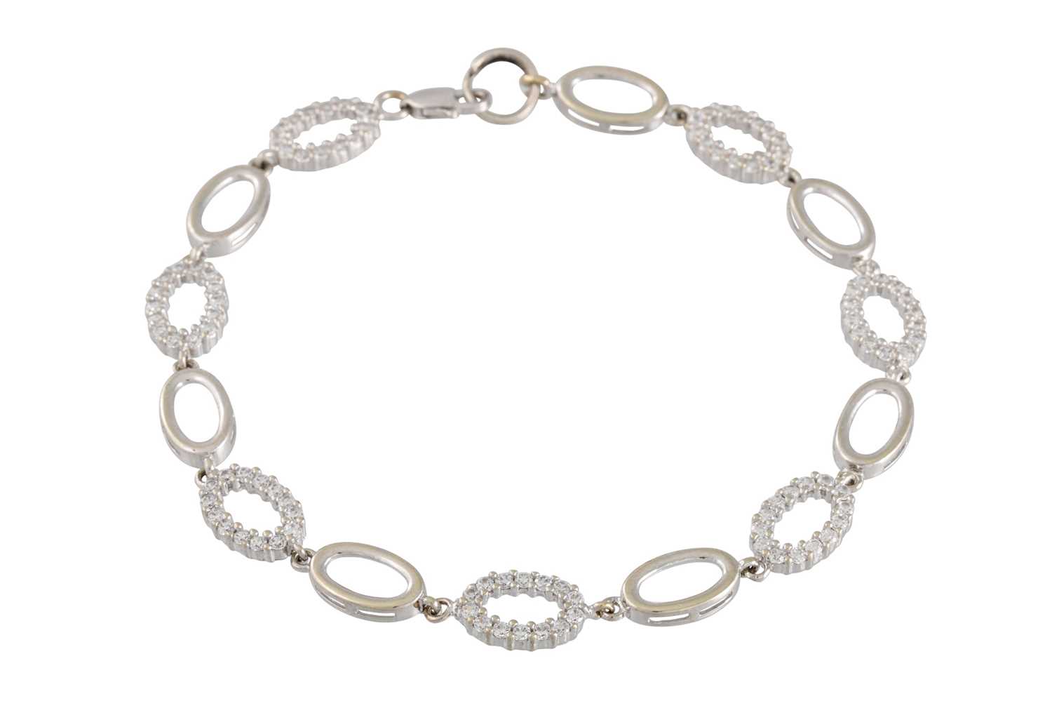 Lot 67 - A WHITE GOLD GEM-SET BRACELET, of oval linked...