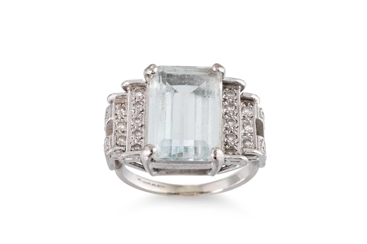 Lot 77 - A TOPAZ AND DIAMOND RING, the rectangular...