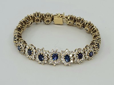 Lot 295 - A SAPPHIRE AND DIAMOND BRACELET, set with oval...