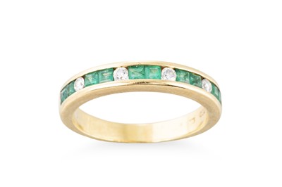 Lot 324 - AN EMERALD AND DIAMOND HALF HOOP RING, the...