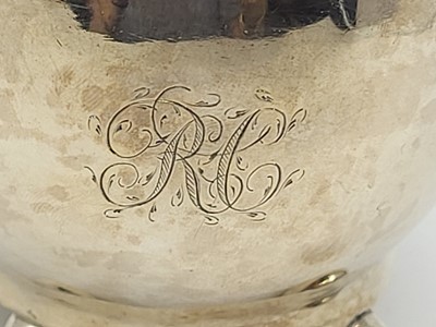 Lot 525 - A GEORGE III SILVER MILK JUG, of plain loaf of...